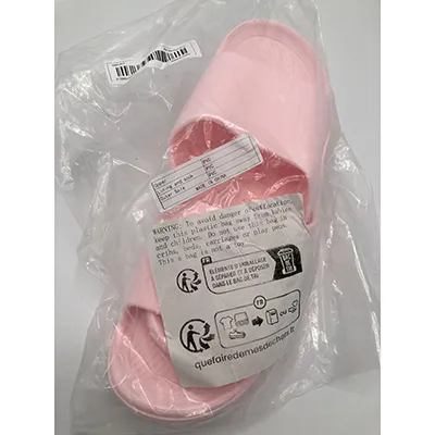 Pink slippers made of PVC plastic. Product sold online.