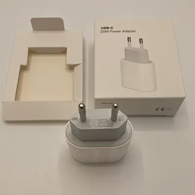 USB-C power adaptor made of white plastic.