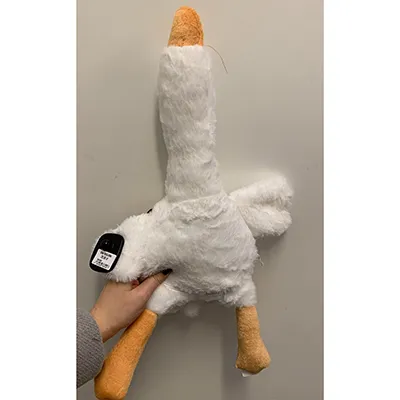 A plush toy in the shape of a goose.