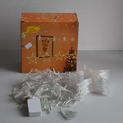 Lighting chain with 120 white, non-replaceable LEDs mounted in plastic figures (stars), a flashing unit, white, transparent electric wire and a socket that allows expansions with additional members.