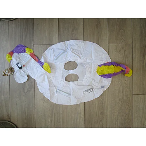 Inflatable swim seat, featuring a unicorn head and with two holes at the bottom.