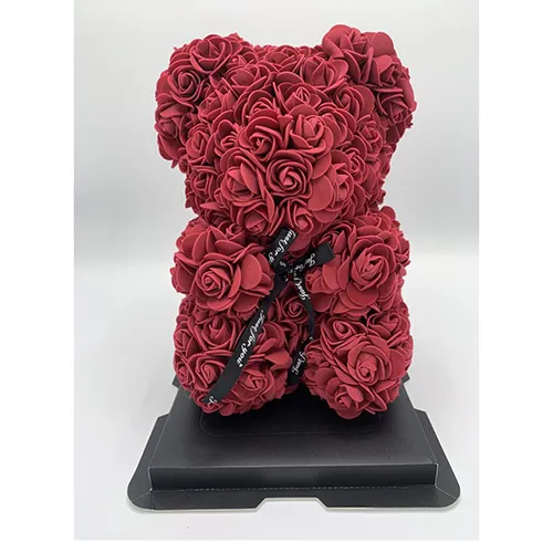 Light in the shape of a teddy bear made of synthetic roses. Product sold online.