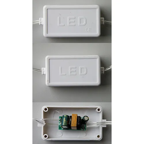 Expandable lighting chain with blue LEDs installed in 8 pieces of textured, downward tapered plastic icicles.