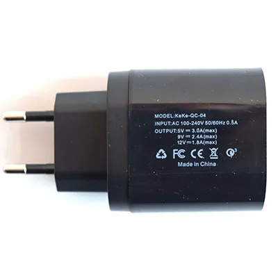 USB charger with black plastic cover, integrated mains plug and four USB-A sockets.