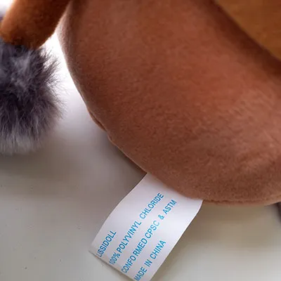 No packaging. A label is attached to the toy.