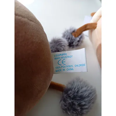 No packaging. A label is attached to the toy.