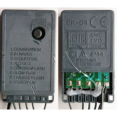 Decorative lighting chain with control unit equipped with 140 purplish white LEDs, pine green insulated wires and a socket that allows expansion with additional units.