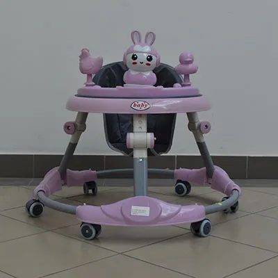 A pink and white musical baby walker, made of plastic and metal parts. The word 