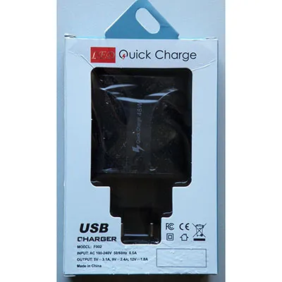 USB charger with black plastic cover, integrated mains plug and four USB-A sockets.