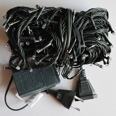 Decorative lighting chain with 240 non-replaceable blue LEDs, a flashing unit, and a socket that enables expansion with additional units.