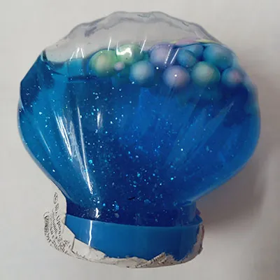 Slime of blue colour with coloured balls.