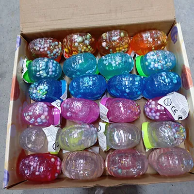 Slime of blue colour with coloured balls.