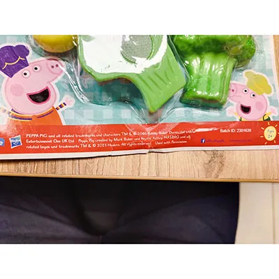 A seven-piece set consisting of vegetable halves and a knife.