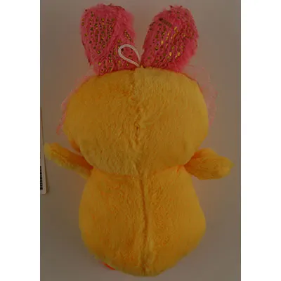 Plush toy, in the shape of a yellow duck, with pink bunny ears, orange webbed feet, black plastic eyes, and an orange plastic beak. A white loop is attached to the head of the toy.