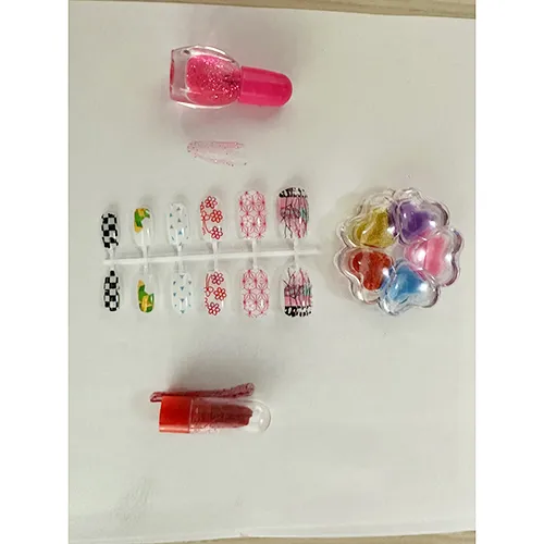 Plastic doll with accessories such as artificial nails, nail polish and a purse.