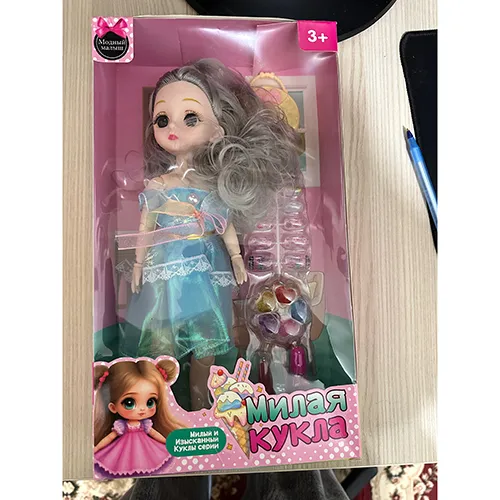 Plastic doll with accessories such as artificial nails, nail polish and a purse.
