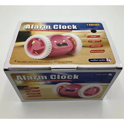 Hard plastic alarm clock, black, fitted with a pair of white wheels.