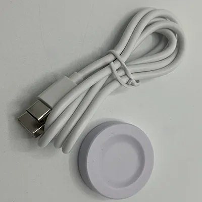 White charger plate with USB/USB-C connection cable. Intended for smartwatches.