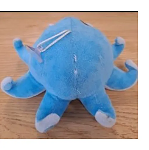 Blue octopus shaped plush with a small suction cup attached to it by a cord.