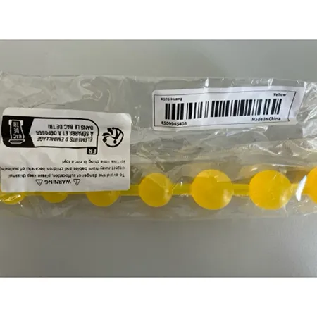 Yellow plastic orgasm balls. Product sold online, in particular via TEMU.