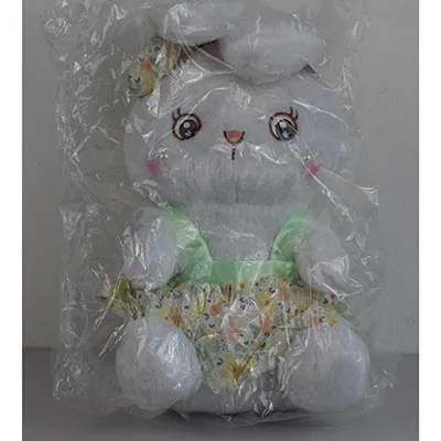 White plush bunny in a dress, with two pearls sewn on the face and a bow on the head. Size of 40 cm.