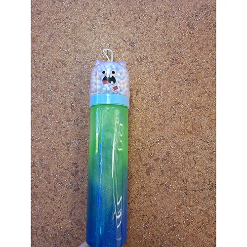 Blue-green toy slime with glitter. Comes together with small colourful balls, in a separate compartment.