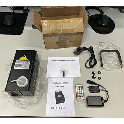 Fog machine for mobile DJ's, parties, small venues with internal RF-receiver (incorporated in internal LED-driver) and an external pluggable RF-receiver (via a 3-pin XLR socket-plug combination) and two remote controls. Product sold online, in particular via djlicht.nl.
