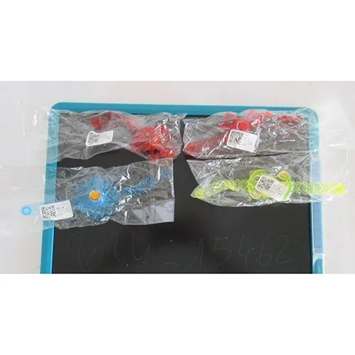 Four elastomer watches with plastic decoration lighting up using a button underneath the watch. Watches' colours: two reds, one yellow, one blue. Product sold online, in particular via Wish (unique identifier: 62554a2eccc05f968a8bcf12).