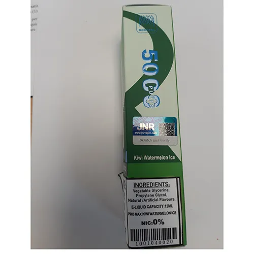 A green disposable e-cigarette within a plastic wrapper
