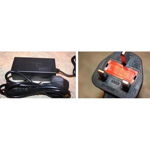 Electric belt sander with wall plug and power supply.