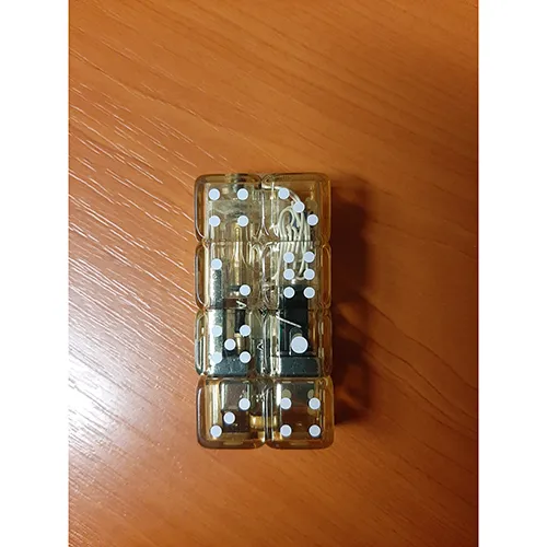 A lighter in the shape of eight playing dice, four in a row next to each other, yellow in color. The upper dice can be flipped up, there is an operating button underneath it. When pressed, a flame will appear. At the same time, the lighter will start flashing a blue-red light.