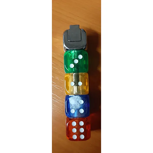 Lighter made up of five cubes stacked on top of each other. One of the outer cubes is silver in colour, it has an operating button (the part of the lighter that is pressed to activate the ignition mechanism) and pressing the button will cause a flame to flash.