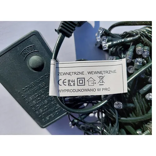 Decorative lighting chain with amber LEDs and a dark green insulated wire, with an eight-program control unit and an extension option.