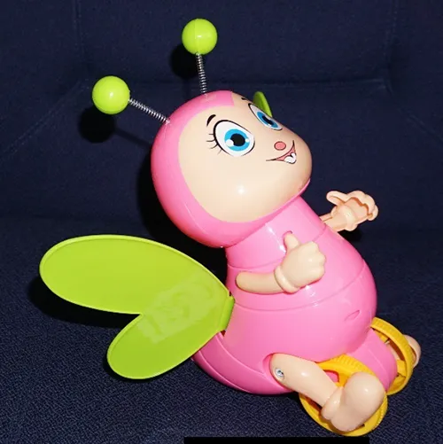 A bee-shaped push along toy, made of plastic material.