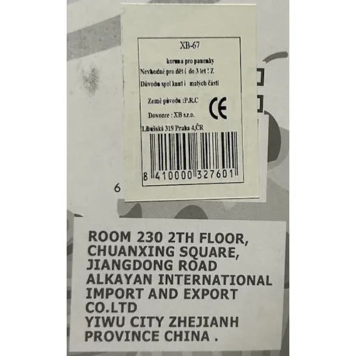 Plastic doll with blonde hair. Size approximately 28 cm. The doll wears a short sleeveless dress in different colours. The accessories include pink chairs and accessories for the kitchen such as a frying pan, plates, a stove and vegetables.