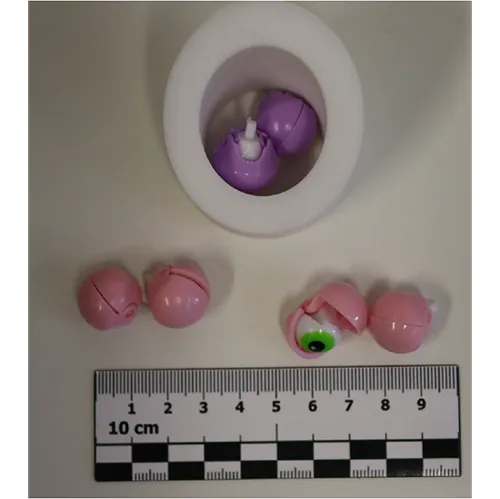 Plastic bunny squeeze toy with eyes appearing when the stomach is pressed.