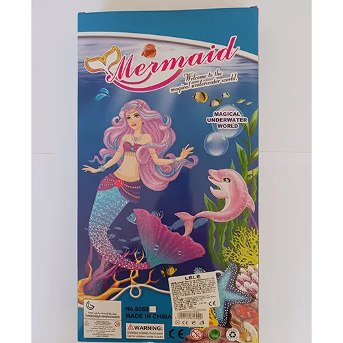 Two mermaid dolls in different sizes, with coloured hair, a plastic hairbrush and a plastic starfish.