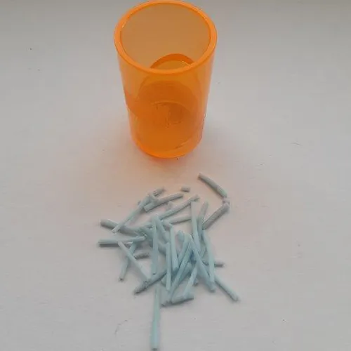 Anti-stress toy, in the shape of a blue caterpillar, made of soft plastic. Inside the toy is a plastic ball that lights up when hit.