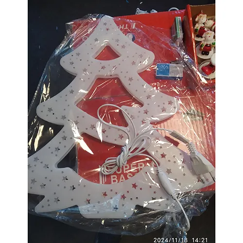 White tree-shaped lighting chain, decorated with stars.