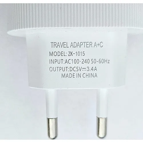 White travel adapter with one USB connector and one USB-C output.