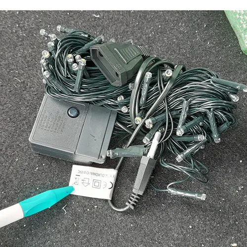 Lighting chain consisting of 100 LEDs, flashing unit, IP44 marking, a flat plug and a flat and stackable socket.