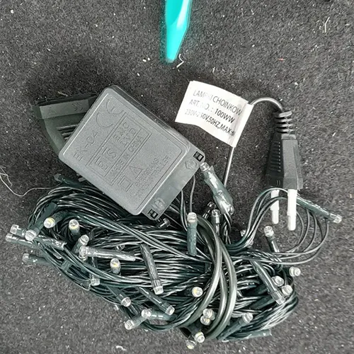 Lighting chain consisting of 100 LEDs, flashing unit, IP44 marking, a flat plug and a flat and stackable socket.