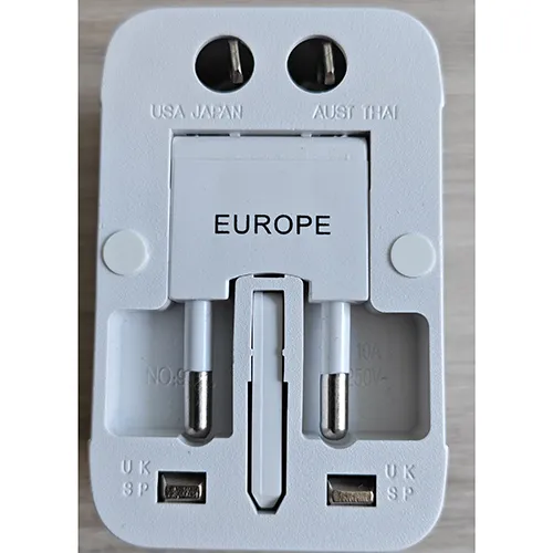 Universal white travel adaptor.