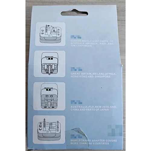 Universal white travel adaptor.