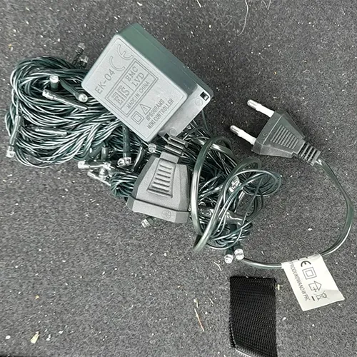 Lighting chain consisting of 100 LEDs, a flashing unit, IP44 marking, a flat plug and a flat,stackable socket.