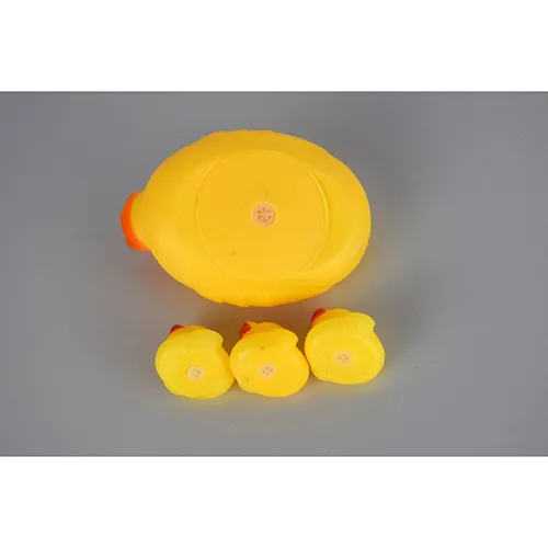 Plastic duck bath toy set, consisting of a larger whistling duck and three smaller ducklings.
