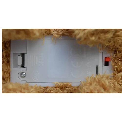 Battery-operated plush toy, in the shape of a walking and barking brown dog.