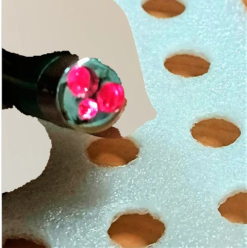 Laser pointer with dual light and laser function, powered by three button batteries.