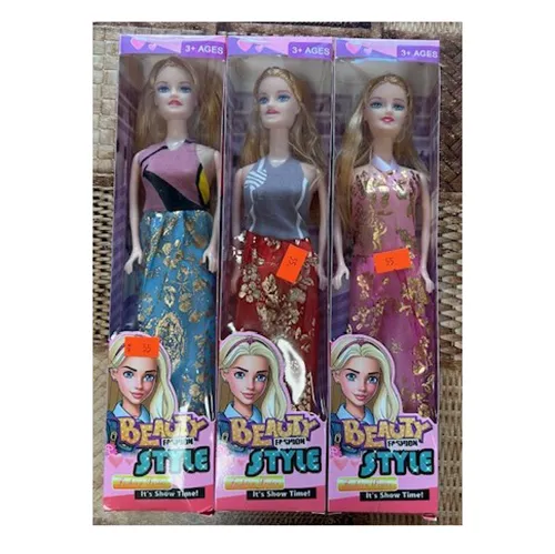 Plastic doll, approximately 28 cm tall. The doll has blonde loose hair partially tied back with a rubber band and wears a long sleeveless dress in various colours and combinations with gold print.