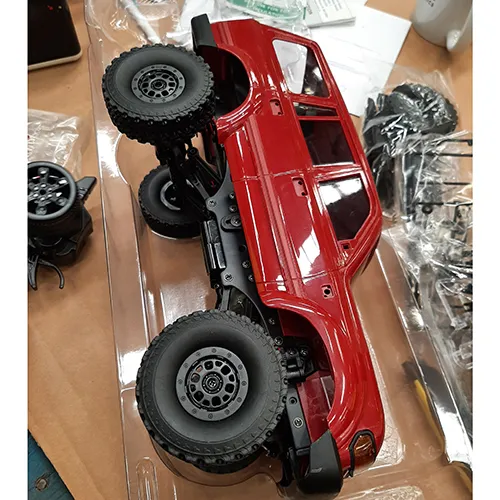 Red toy radio controlled ruck with remote controller. Product sold online, in particular via Amazon.